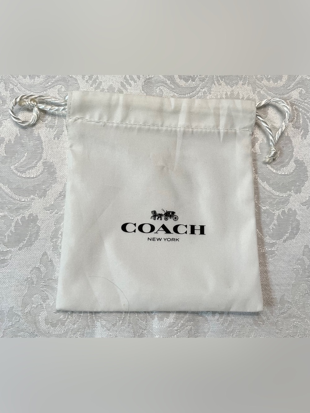 Coach Satin Drawstring Jewelry Pouch in White with Black Logo NWOT